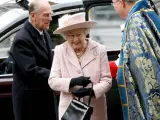 La Reina Isabel II y su esposo el Duque de Edimburgo llegan a la Abadía de Westminster.