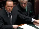 El primer ministro italiano, Silvio Berlusconi, junto al líder de la Liga Norte y aliado suyo, Umberto Bossi.