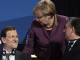 Rajoy y Merkel, en el Congreso del Partido Popular Europeo (PPE) de Bucarest.