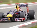 El australiano Mark Webber circula con su coche en los entrenamientos del GP de Alemania.