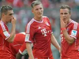 Los jugadores del Bayern de Múnich Philip Lahm, Bastian Schweinsteiger y Mario Götze, en un partido de su equipo disputado en el Allianz Arena.