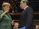 La canciller Angela Merkel y el presidente del BCE, Mario Draghi.