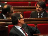 Artur Mas, Oriol Pujol y Jordi Turull, durante uno pleno del Parlamento catalán.
