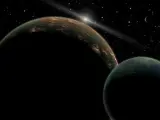 Imagen de Plutón (izquierda) y su satélite Caronte.