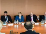 La canciller alemana, Angela Merkel, reunida con su equipo de seguridad tras el tiroteo de Múnich.