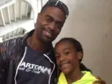 El velocista Tyson Gay, con su hija Trinity.