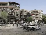 Estado en el que ha quedado la plaza Al Gadir de Damasco tras un atentado suicida con coches bomba.