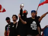 De izquierda a derecha, los cantantes puertorriqueños Ricky Martin, Tommy Torres, Bad Bunny y Residente, durante una manifestación en contra del gobernador de Puerto Rico, Ricardo Roselló, en San Juan.