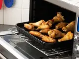 Alitas de pollo al horno, crujientes y doradas.