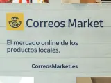 Logo de Correos Market en una oficina de Madrid (España)