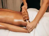 Woman on anti cellulite massage treatment. Madero therapy.