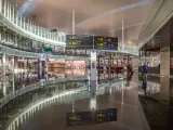 Barcelona, Spain - July 14, 2016: The public area at the Terminal T1 of El Prat-Barcelona airport. This airport was inaugurated in 1963. Airport is one of the biggest in Europe and one of the busiest in the world. People are walking.