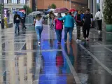 Varias personas con paraguas, lluvia, tormentas, precipitaciones, tiempo, meteorología