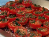 sun dried tomatoes with herbs and oil in a hot surface