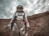 Spaceman exploring nameless planet